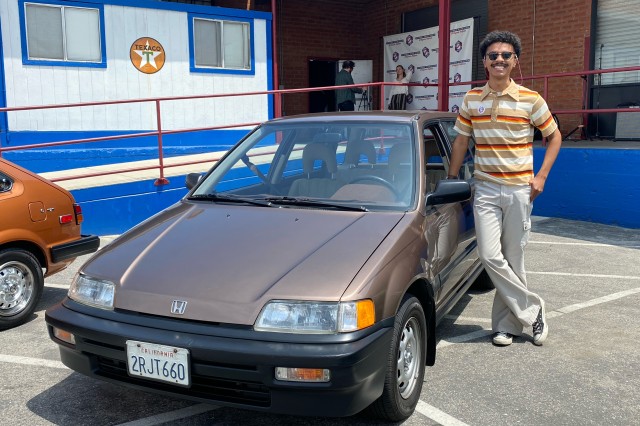Man standing next to his car, a brown 1990 Honda Civic wagon