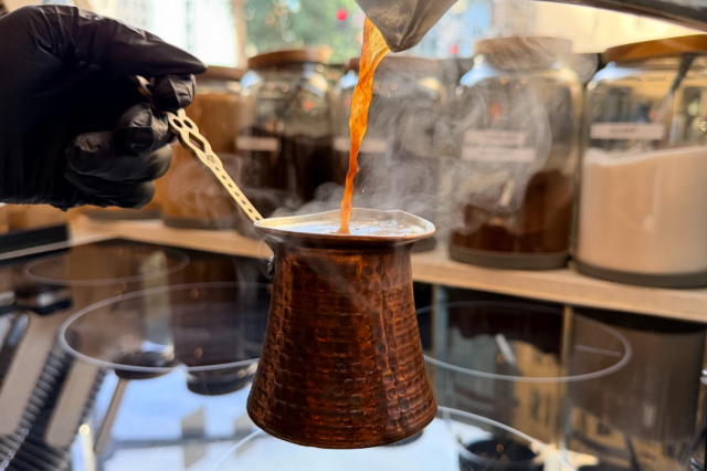 A small, ornate, traditional pot used for brewing Turkish coffee