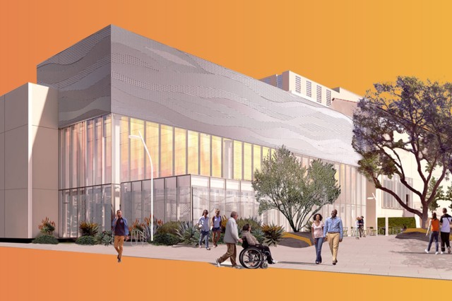 Visitors moving in front of a cut-out silver building with a row of glowing windows in the middle, against an orange background