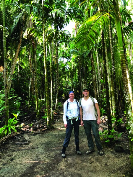 Amy Gusick with her colleague, Matthew Napolitano, surveying in the jungle on Yap